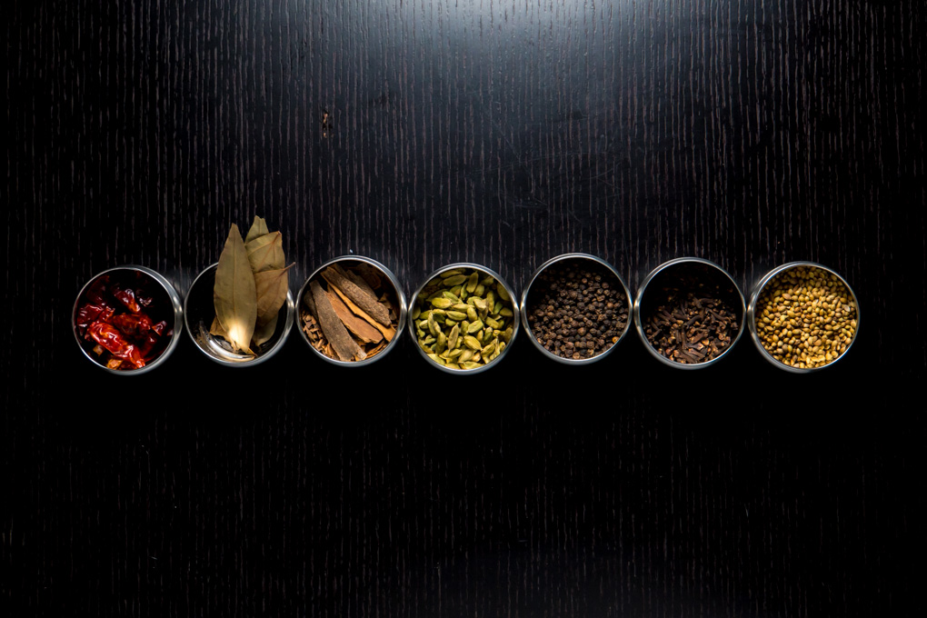 basic indian spices - row of spices in bowls