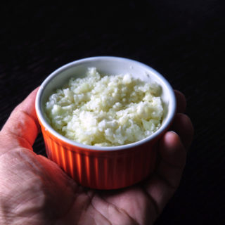 Easy Cauliflower Rice - cooked in hand (angle)